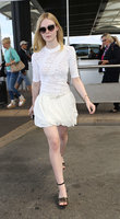 Elle-Fanning-in-White-Dress-at-Nice-Airport--02.jpg