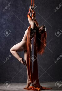 96012020-beautiful-nude-dancer-on-aerial-silk-graceful-contortion-acrobat-performs-a-trick-on-...jpg