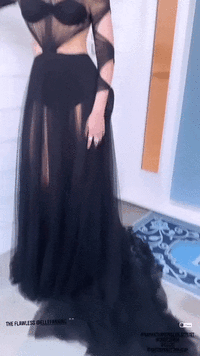 Elle-Fanning-in-a-sheer-black-dress-06.11.2021-01 (1).gif
